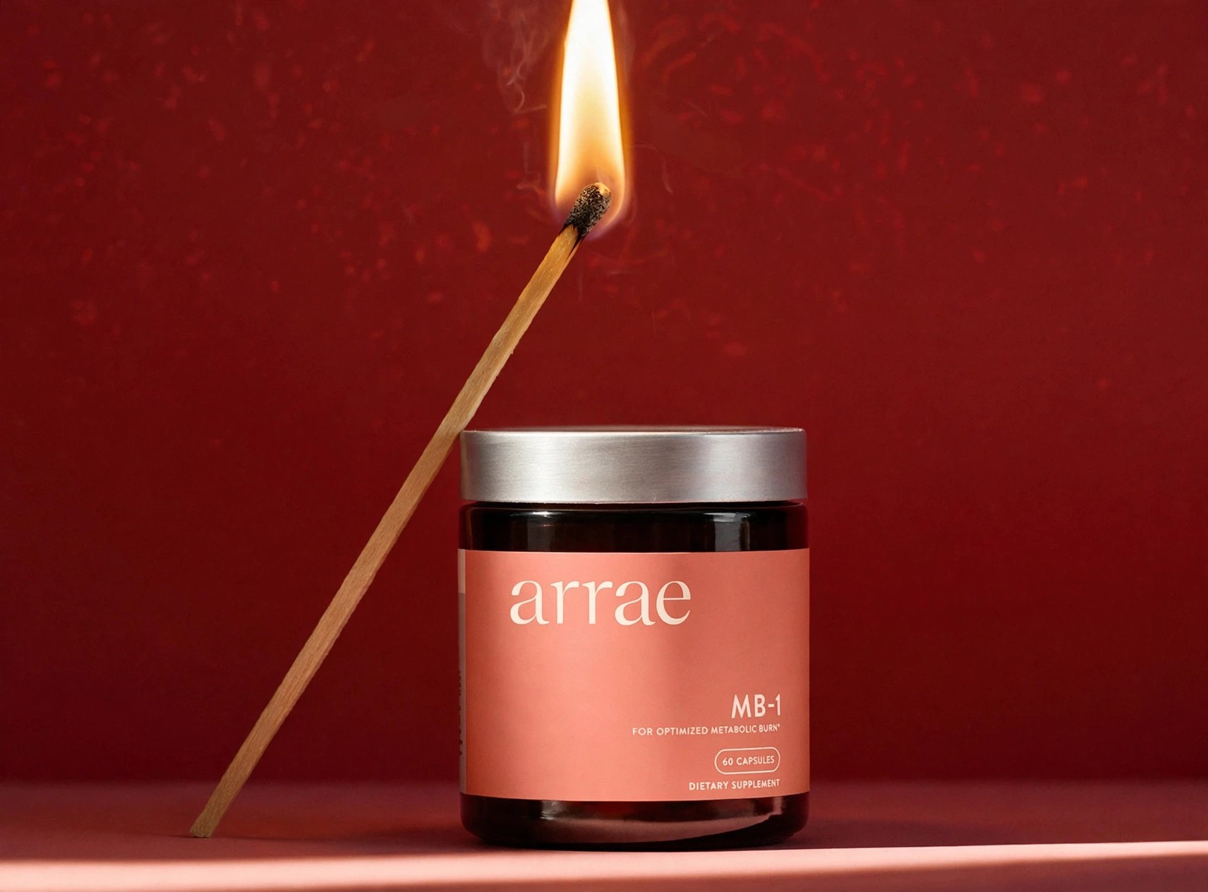 Arrae MB-1 jar photographed with a lit match beside it.