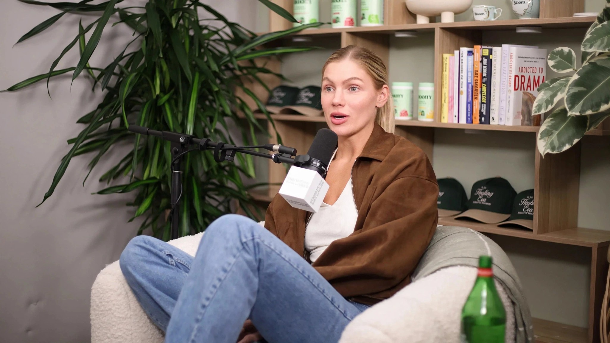 Mari Llewellyn seated with a microphone during a podcast interview.