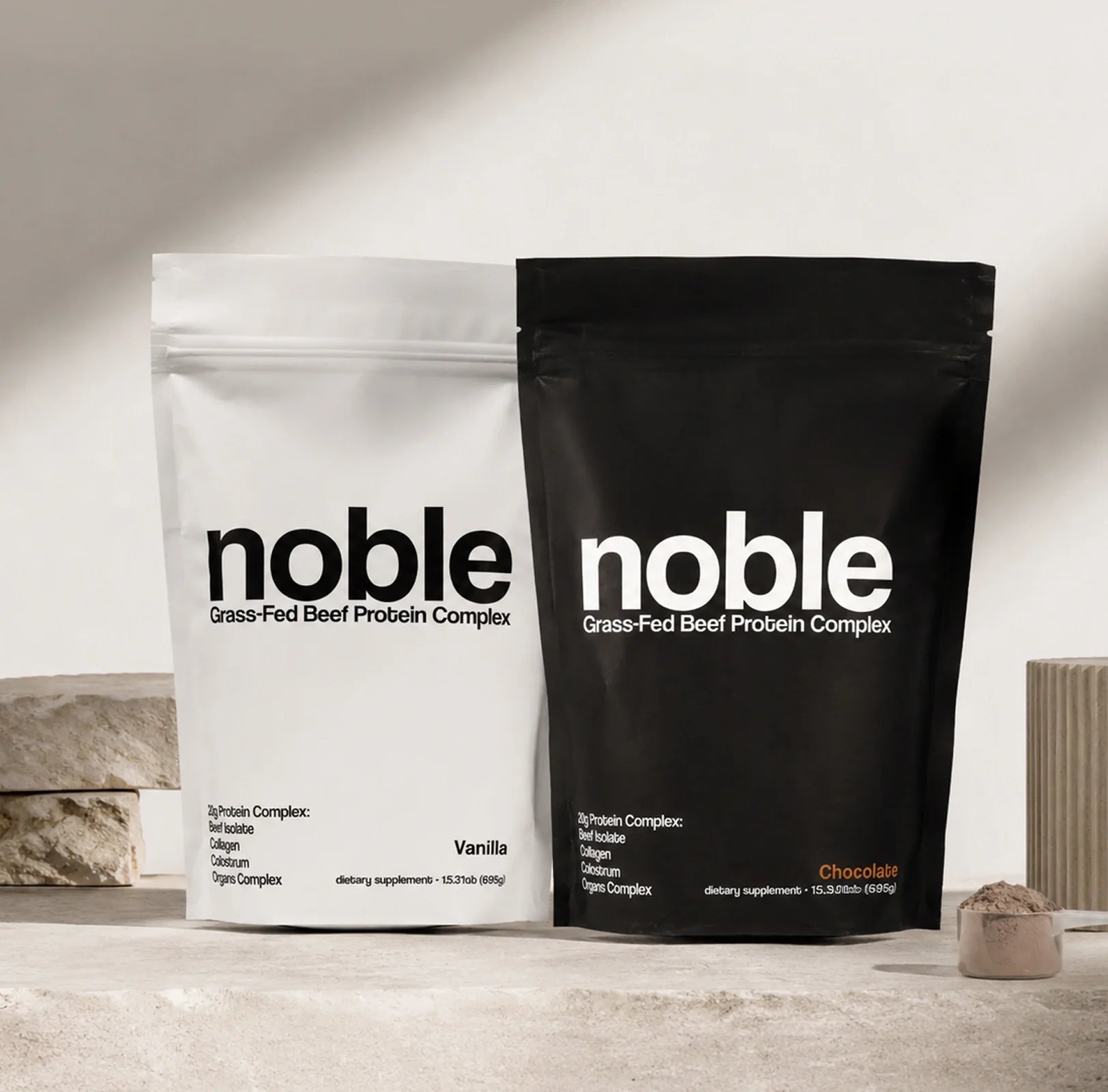White vanilla and black chocolate protein bags side by side.